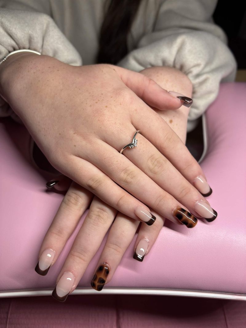 Square nails with chocolate brown French tips and tortoiseshell accent nails